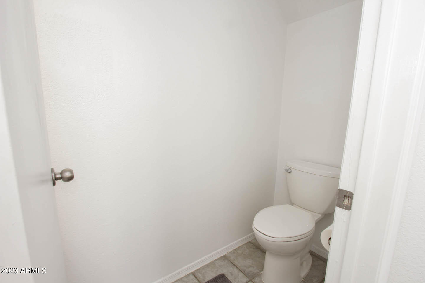 4401 West Tonto Road Glendale, AZ 85308 - Photo 16 of 29 a white toilet sitting next to a white wall