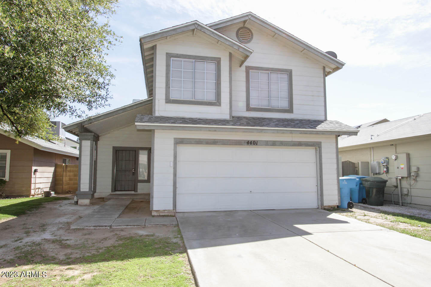 4401 West Tonto Road Glendale, AZ 85308 - Photo 2 of 29 a front view of a house with a garage