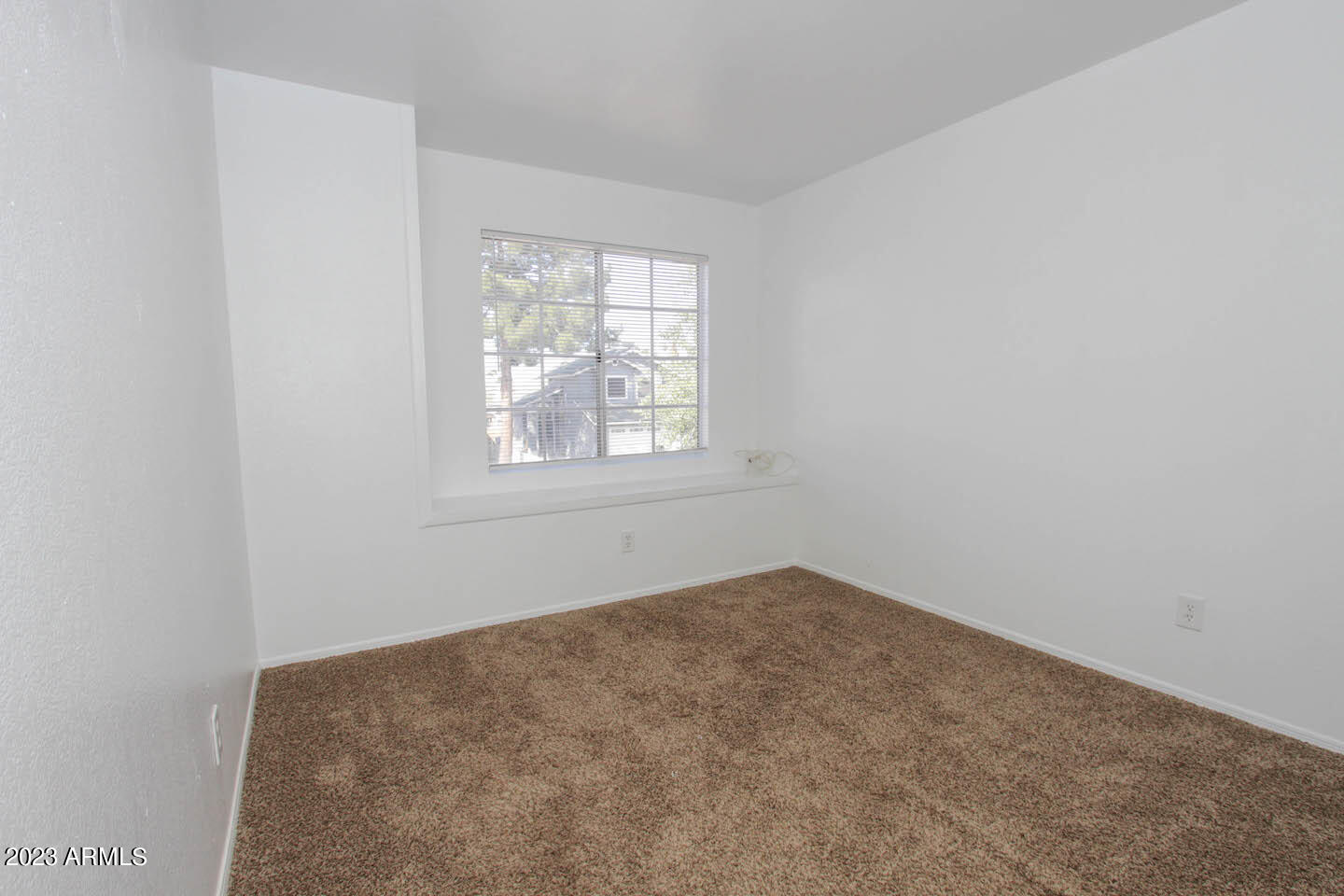 4401 West Tonto Road Glendale, AZ 85308 - Photo 26 of 29 an empty room with windows