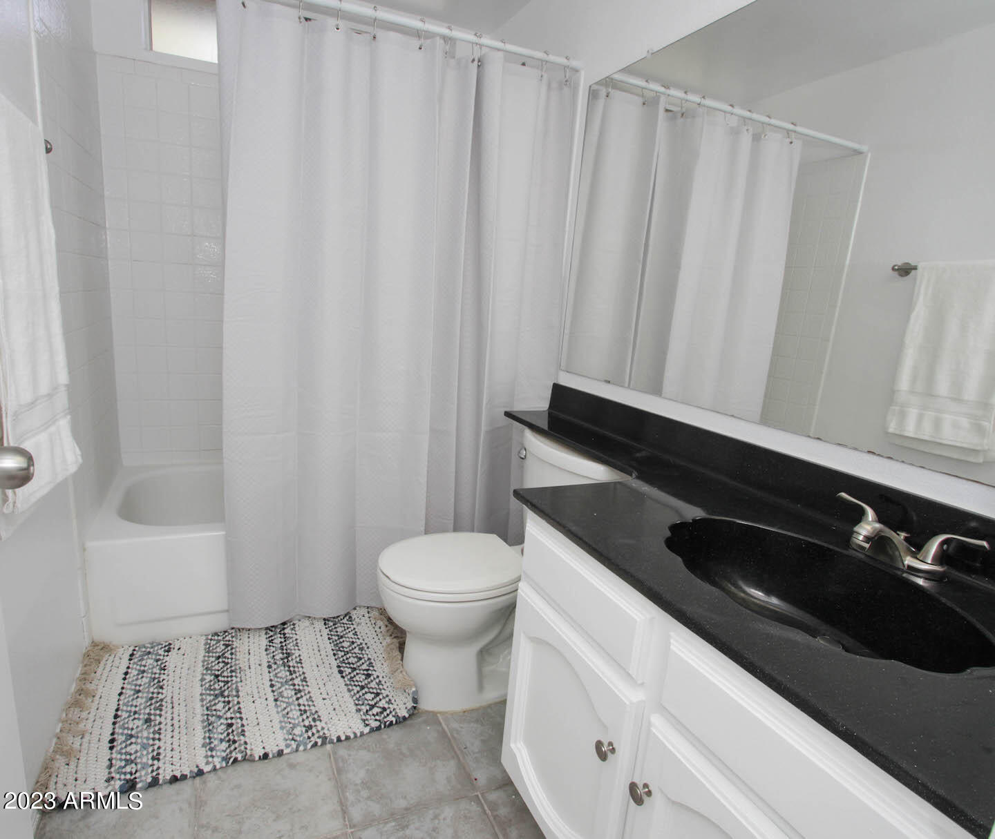 4401 West Tonto Road Glendale, AZ 85308 - Photo 29 of 29 a bathroom with a sink and a toilet