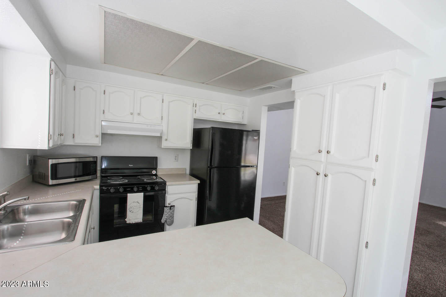 4401 West Tonto Road Glendale, AZ 85308 - Photo 9 of 29 a kitchen with stainless steel appliances a refrigerator a stove a microwave and a refrigerator