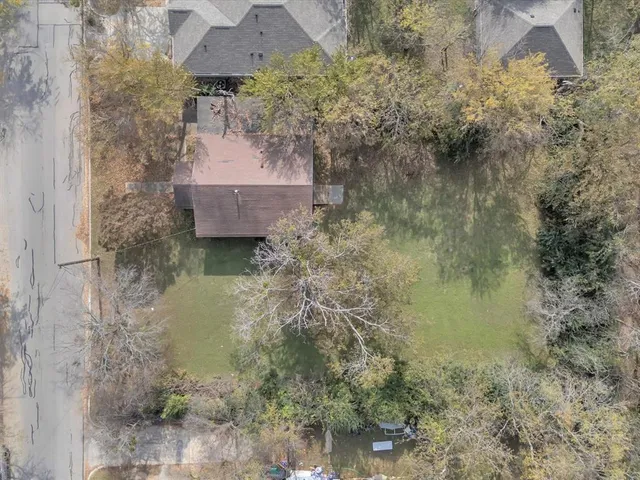 a aerial view of a house with a yard