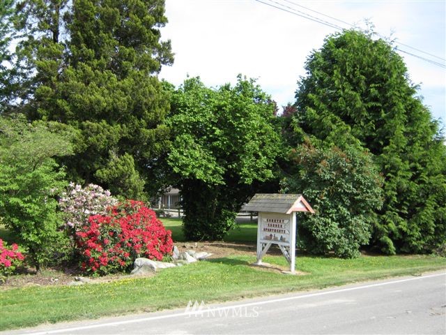 9240 Garrison Road Sumas, WA 98295 - Photo 1 of 16 a backyard of a house with lots of green space and plants