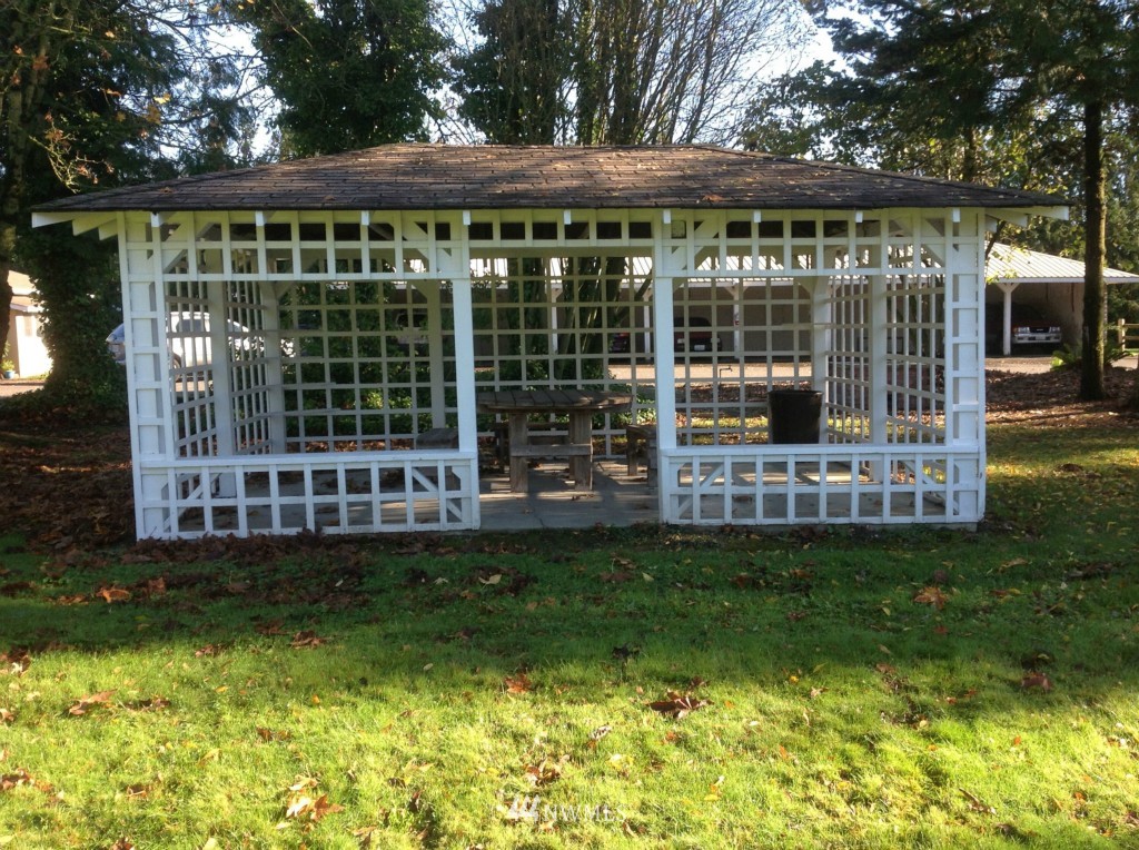 9240 Garrison Road Sumas, WA 98295 - Photo 2 of 16 a view of a house with backyard porch and sitting area