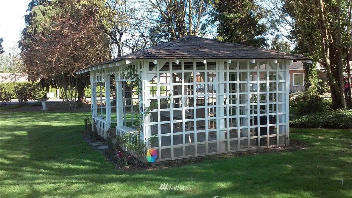 9240 Garrison Road Sumas, WA 98295 - Photo 15 of 16 a view of a house with a yard and plants