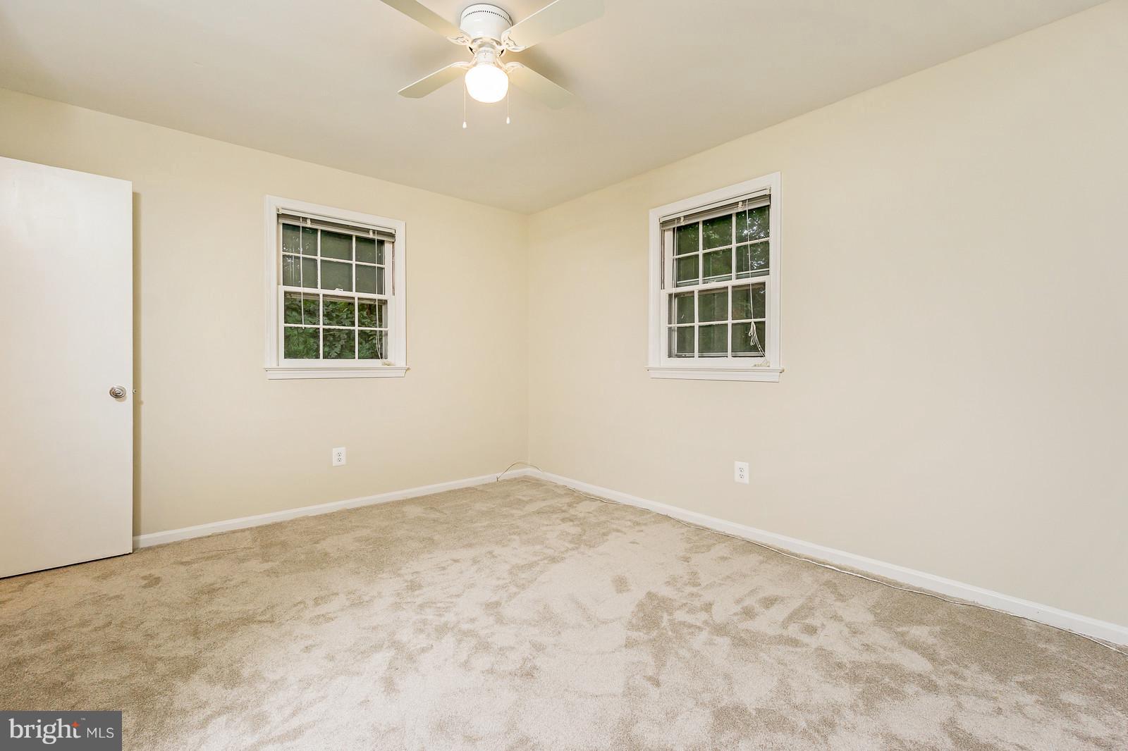 6723 Huntsman Boulevard Springfield, VA 22152 - Photo 13 of 32 an empty room with a window