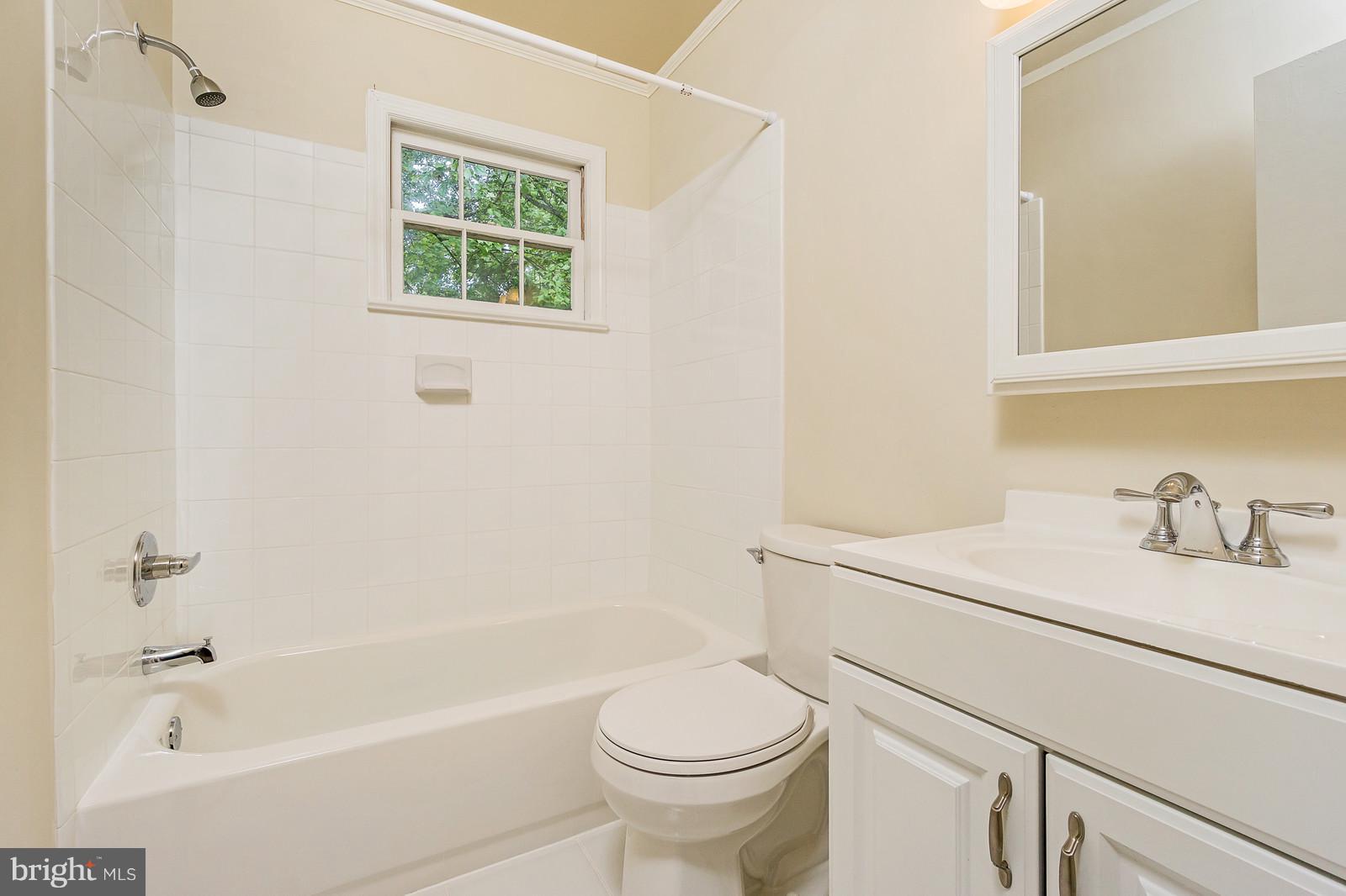 6723 Huntsman Boulevard Springfield, VA 22152 - Photo 14 of 32 a bathroom with a sink toilet and shower