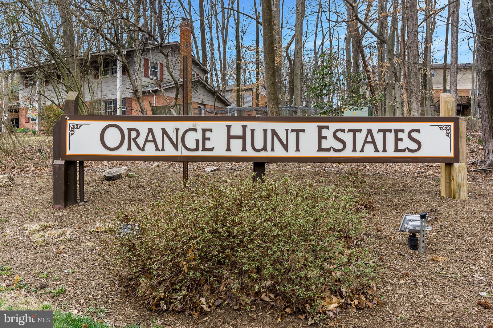 6723 Huntsman Boulevard Springfield, VA 22152 - Photo 21 of 32 a street sign that is on a pole
