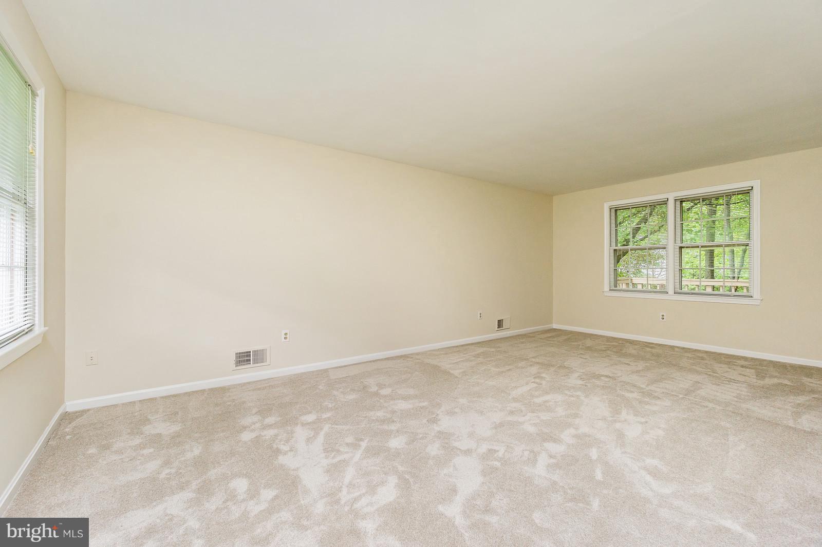 6723 Huntsman Boulevard Springfield, VA 22152 - Photo 4 of 32 an empty room with windows