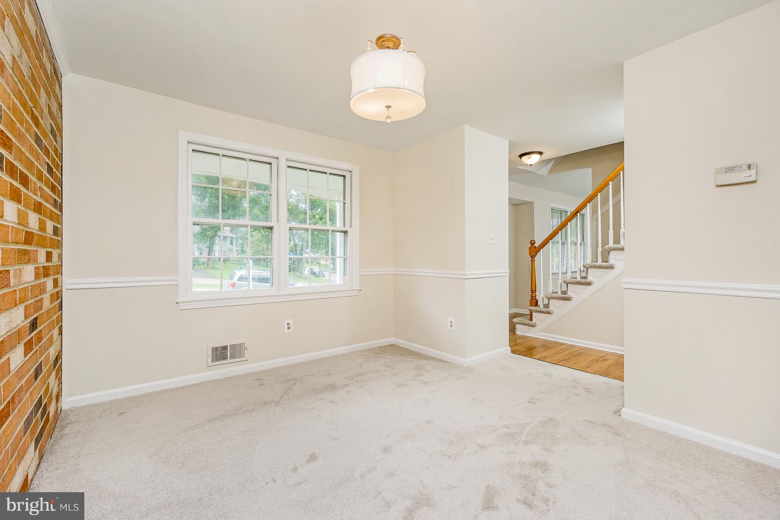 6723 Huntsman Boulevard Springfield, VA 22152 - Photo 5 of 32 a view of an empty room with a window