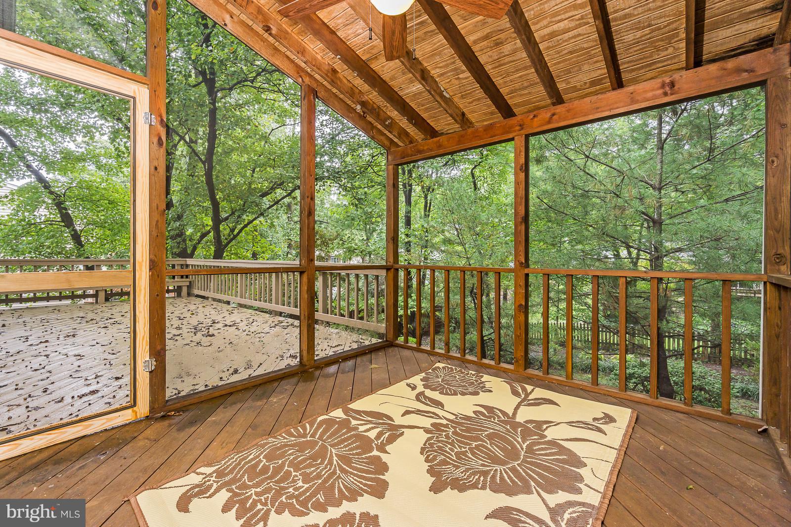 6723 Huntsman Boulevard Springfield, VA 22152 - Photo 9 of 32 a view of a balcony with wooden floor