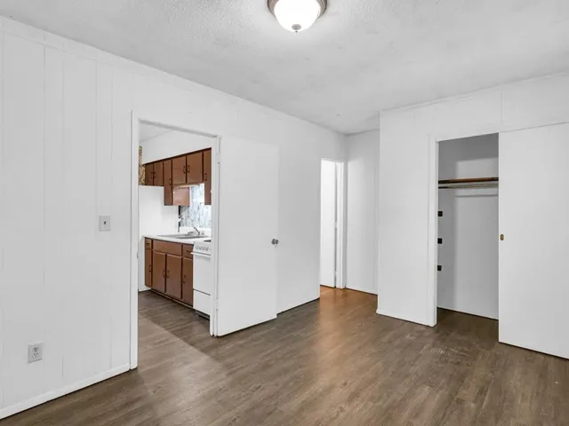 a view of a storage & utility room with wooden floor