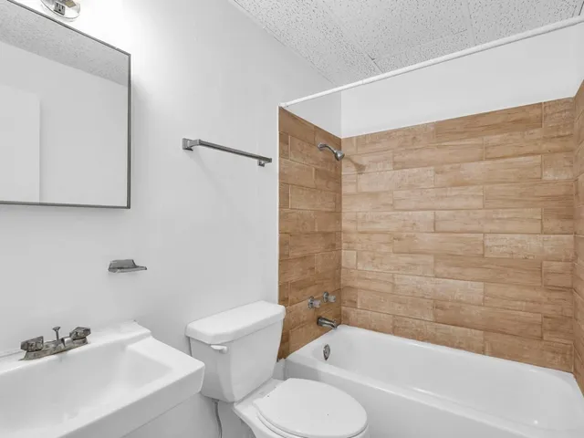 a bathroom with a sink and a bathtub