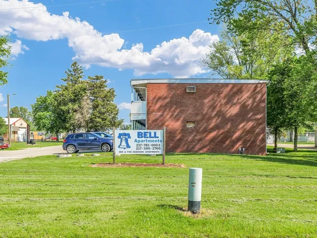a view of a golf course with chairs