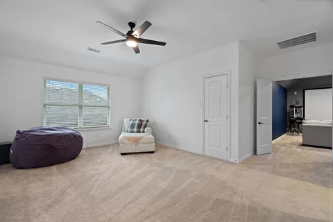 a living room with furniture and window