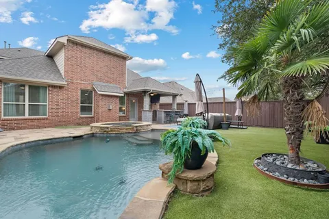 a front view of a house with swimming pool
