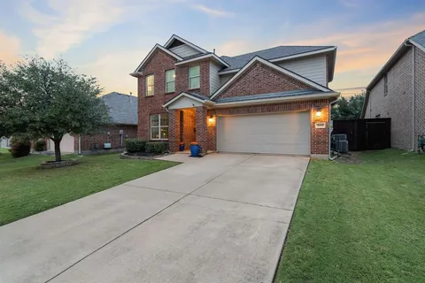 an aerial view of a house with outdoor space