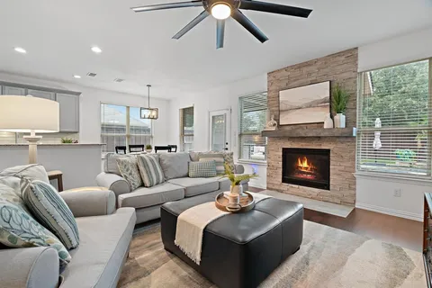 a living room with furniture and a fireplace