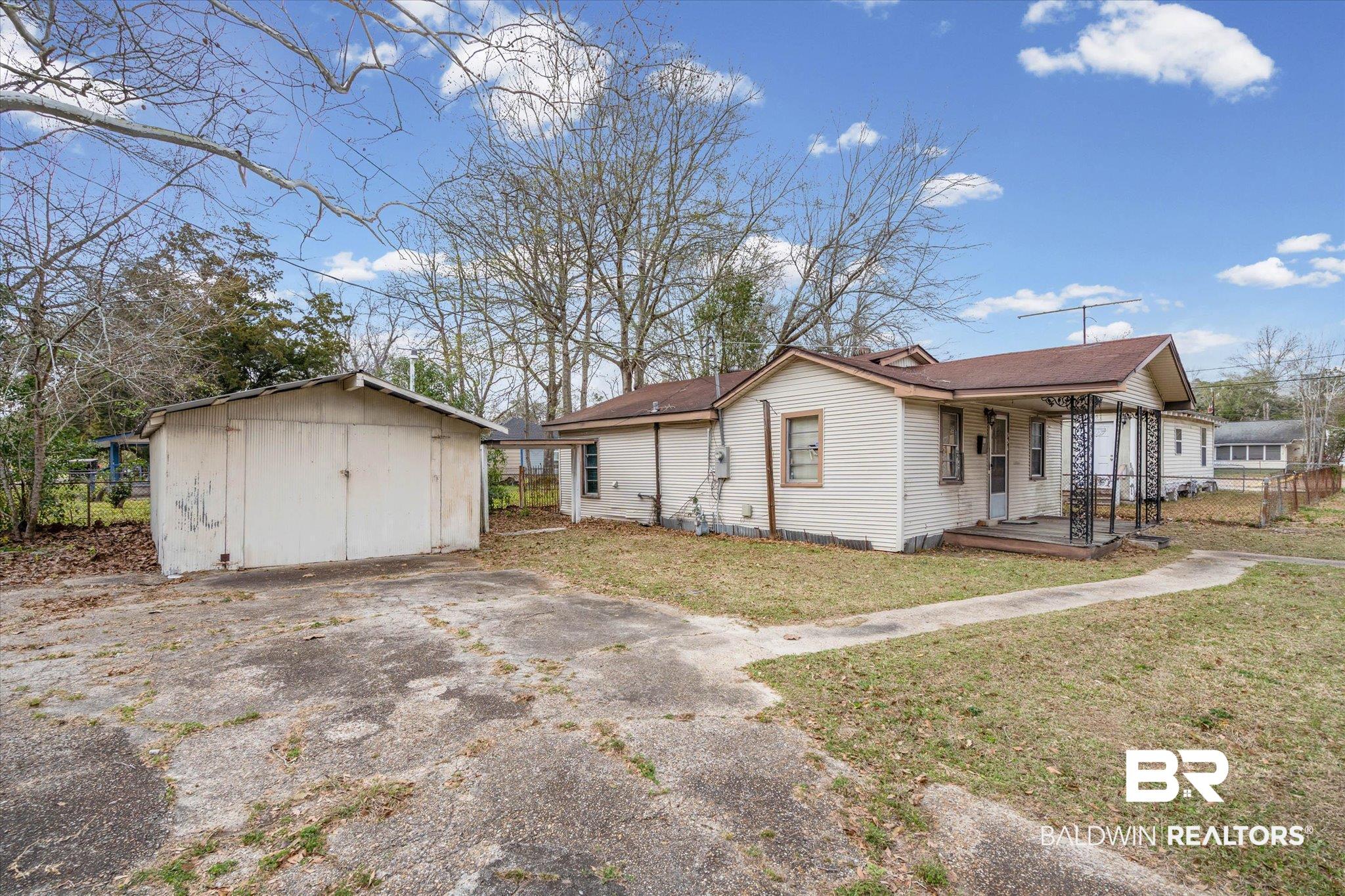 351 Kansas Street Mobile, AL 36611 - Photo 7 of 7 View of property exterior featuring a shed