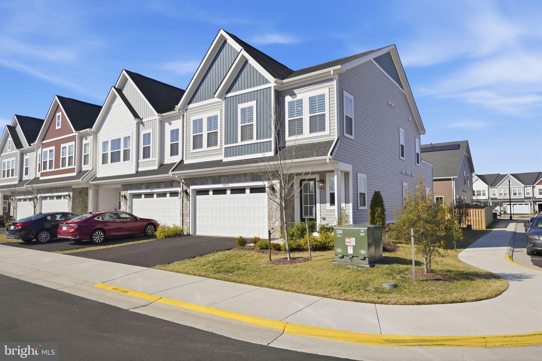 14679 Grand Cru Loop Gainesville, VA 20155 - Photo 1 of 41 a front view of a house with entertaining space