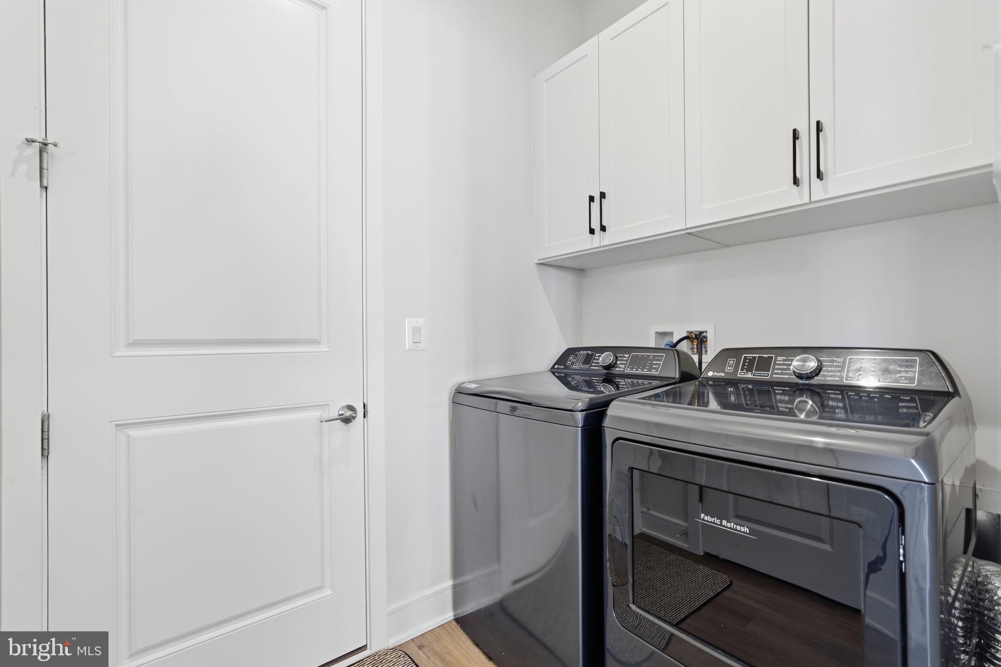 14679 Grand Cru Loop Gainesville, VA 20155 - Photo 20 of 41 a white stove top oven sitting inside of a kitchen
