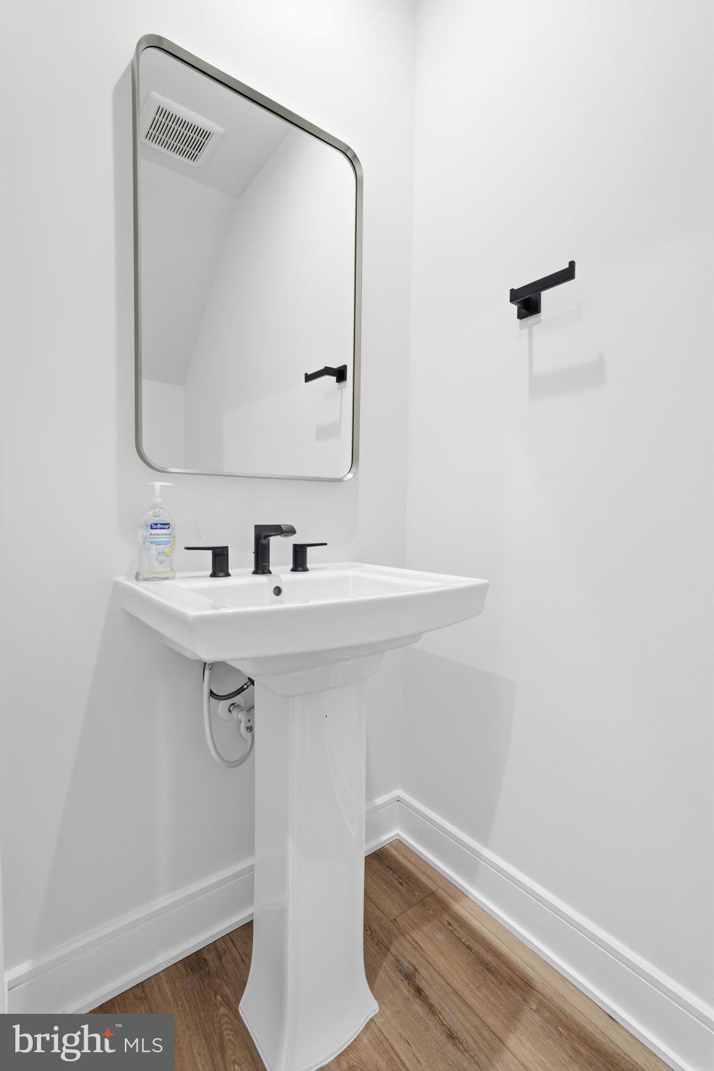 14679 Grand Cru Loop Gainesville, VA 20155 - Photo 21 of 41 a bathroom with a sink a mirror and vanity