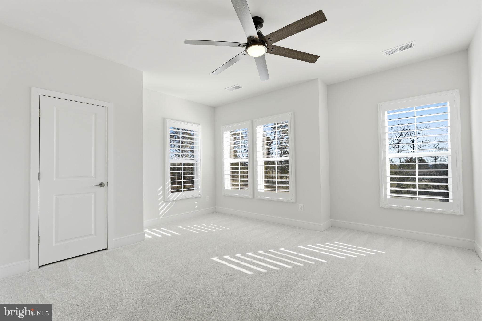 14679 Grand Cru Loop Gainesville, VA 20155 - Photo 29 of 41 a view of an empty room with a window and a kitchen