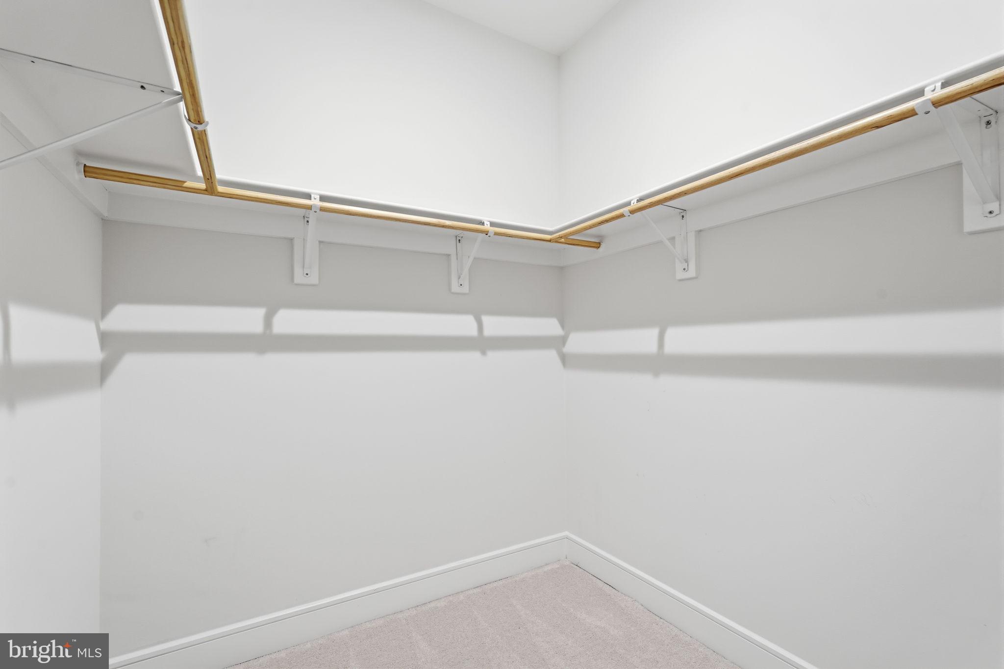 14679 Grand Cru Loop Gainesville, VA 20155 - Photo 30 of 41 a view of a room with racks on the wall