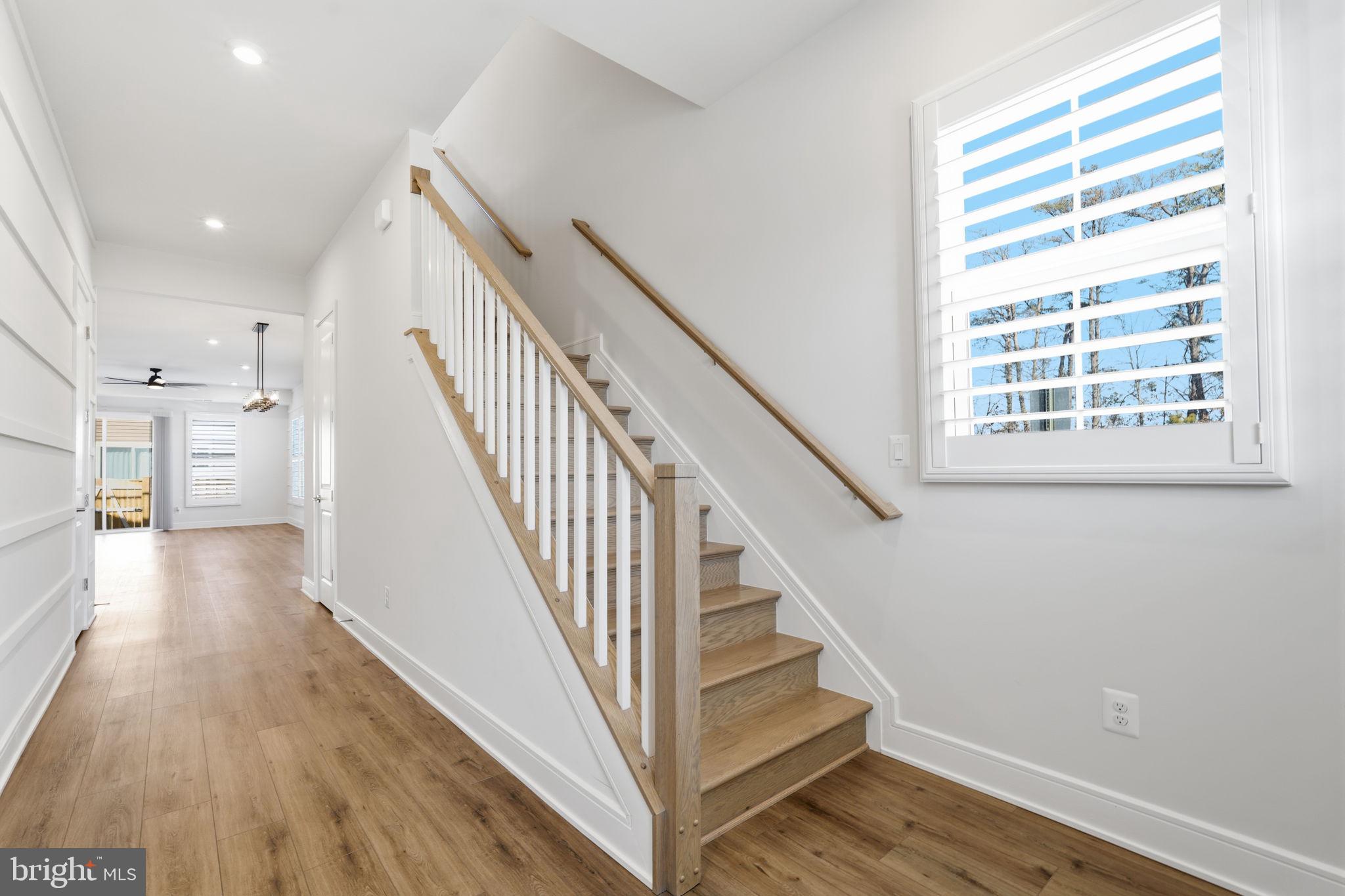 14679 Grand Cru Loop Gainesville, VA 20155 - Photo 3 of 41 a view of entryway and hall with wooden floor