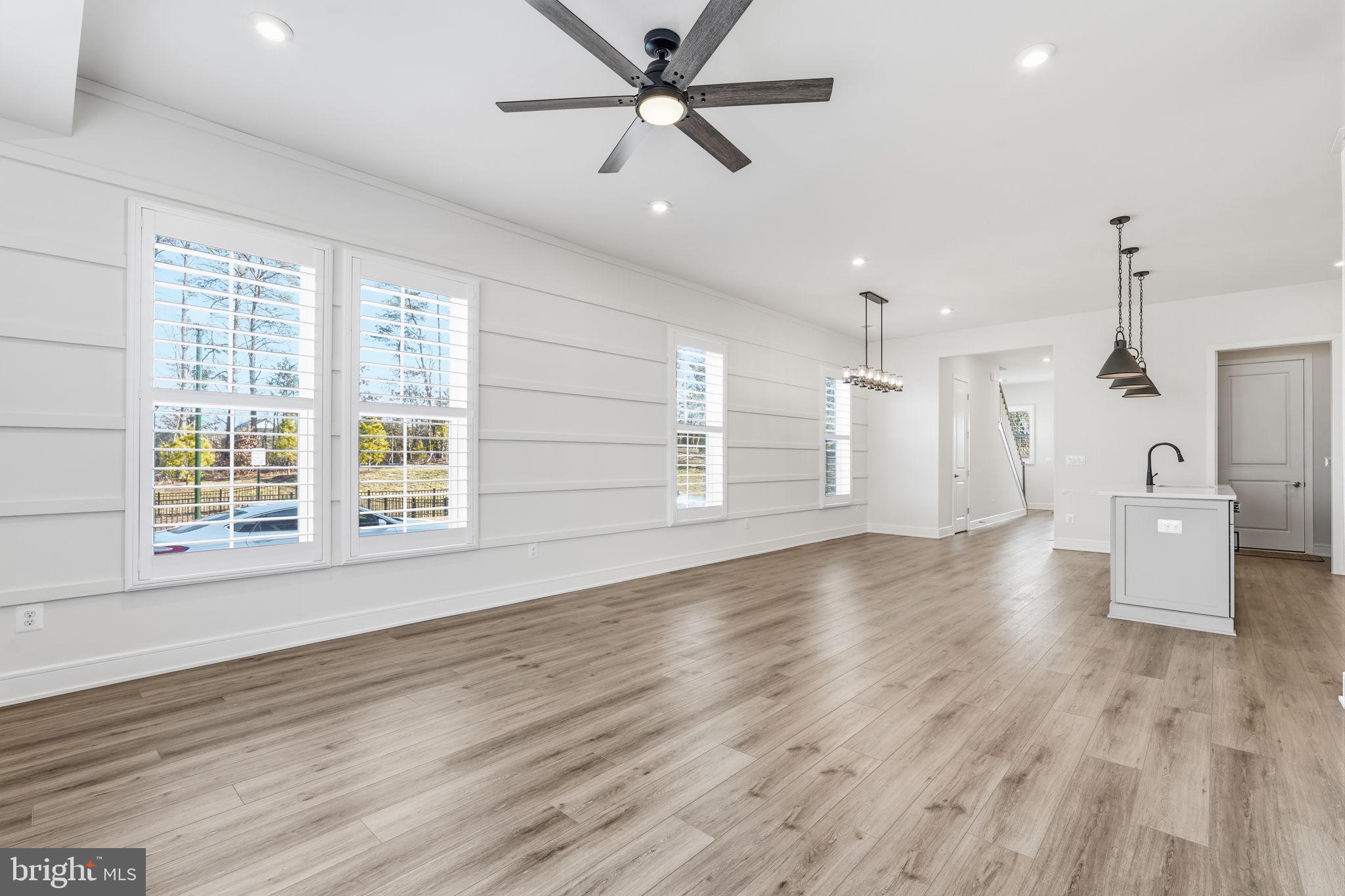 14679 Grand Cru Loop Gainesville, VA 20155 - Photo 4 of 41 an empty room with wooden floor and windows