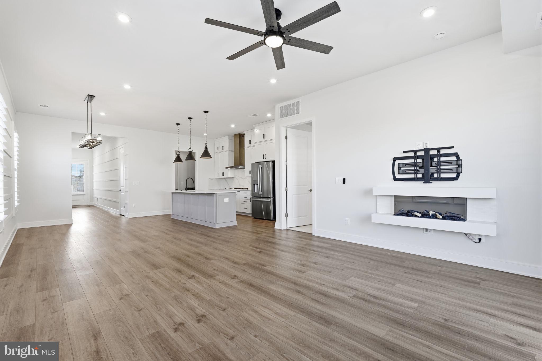 14679 Grand Cru Loop Gainesville, VA 20155 - Photo 10 of 41 a view of a kitchen with a sink and a refrigerator