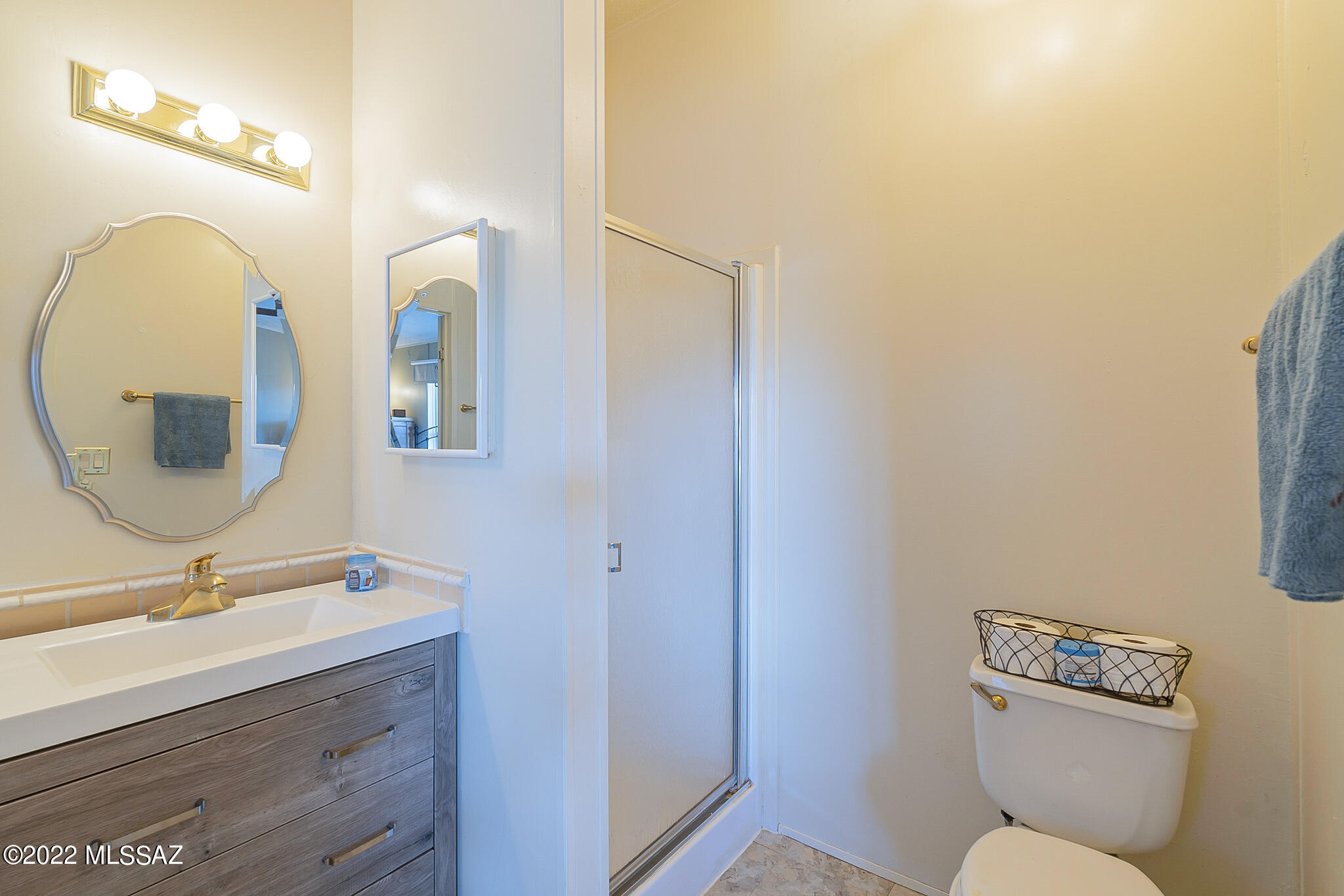 5285 North Puma Road Marana, AZ 85653 - Photo 22 of 46 a bathroom with a toilet sink and mirror