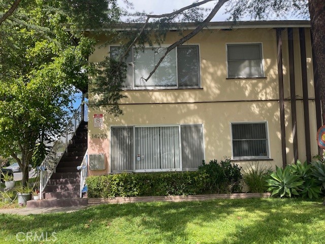 14225 Riverside Drive Sherman Oaks, CA 91423 - Photo 1 of 15 a front view of a house with garden