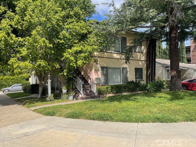 14225 Riverside Drive Sherman Oaks, CA 91423 - Photo 2 of 15 front view of a house with a yard