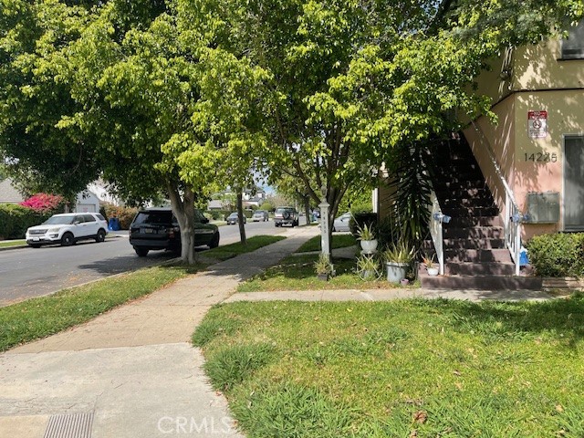 14225 Riverside Drive Sherman Oaks, CA 91423 - Photo 3 of 15 a view of a street with a car parked in front of it