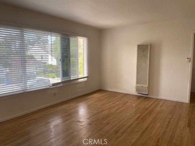 14225 Riverside Drive Sherman Oaks, CA 91423 - Photo 4 of 15 an empty room with wooden floor and windows