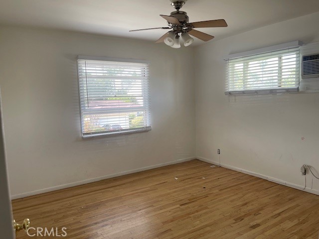14225 Riverside Drive Sherman Oaks, CA 91423 - Photo 10 of 15 a view of empty room with wooden floor and fan