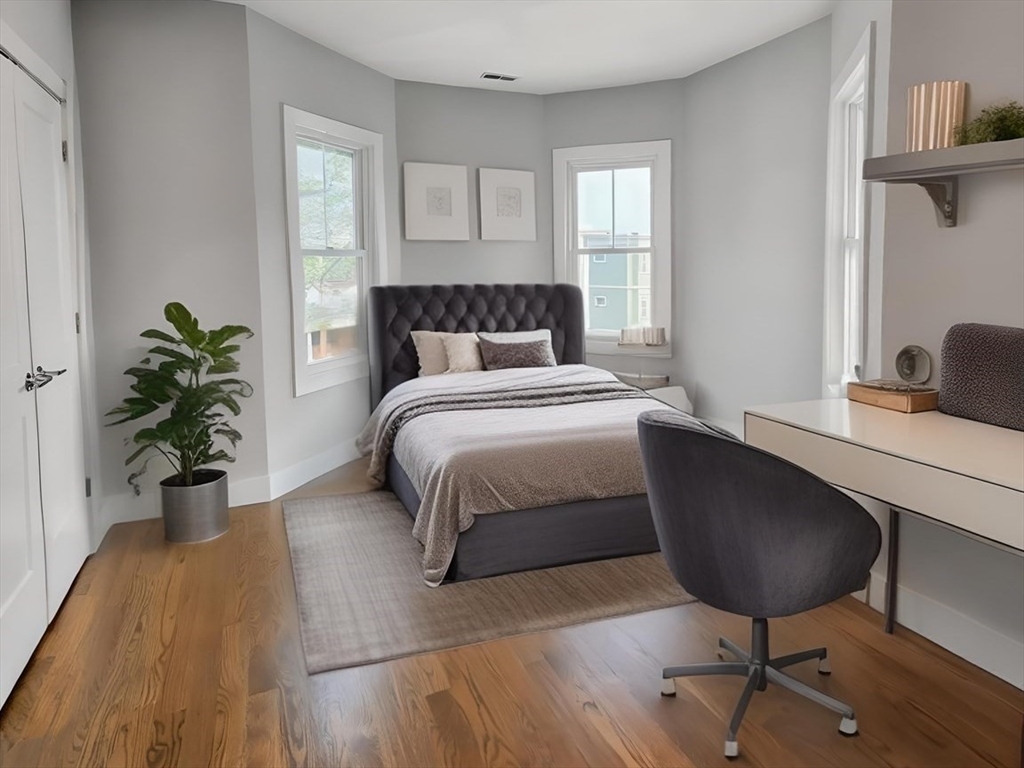84 Romsey Street, Unit 3 Boston, MA 02125 - Photo 5 of 22 a bedroom with a bed potted plant with the window