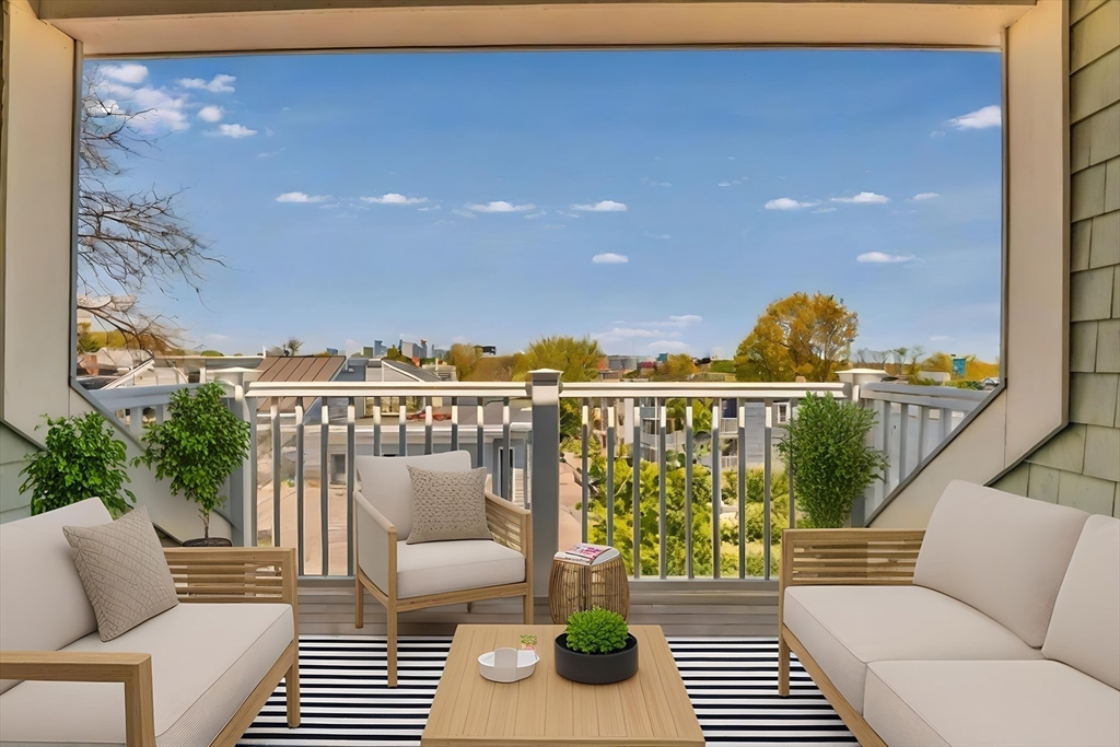 84 Romsey Street, Unit 3 Boston, MA 02125 - Photo 10 of 22 a balcony with wooden floor