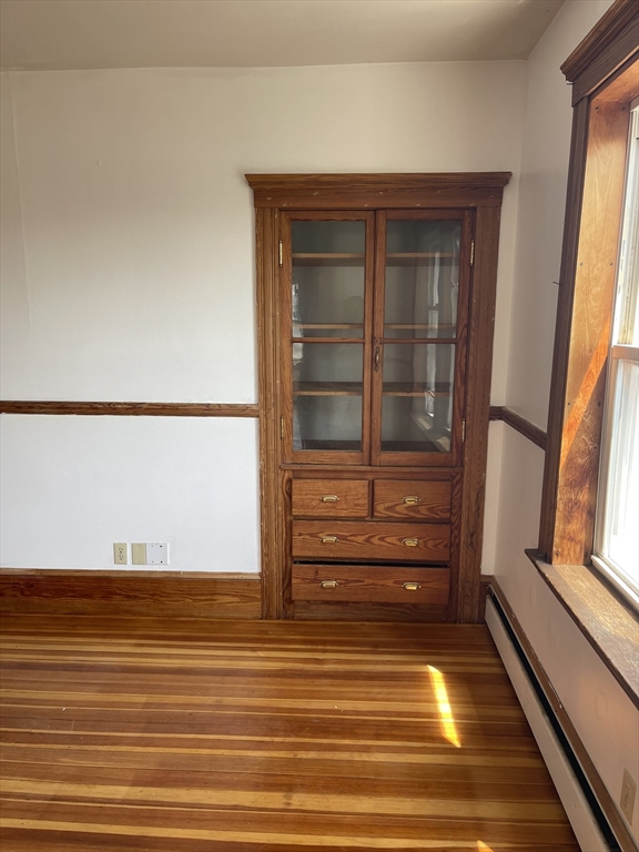 25 Perkins Street, Unit 3 Salem, MA 01970 - Photo 4 of 8 a view of walk in closet with empty racks
