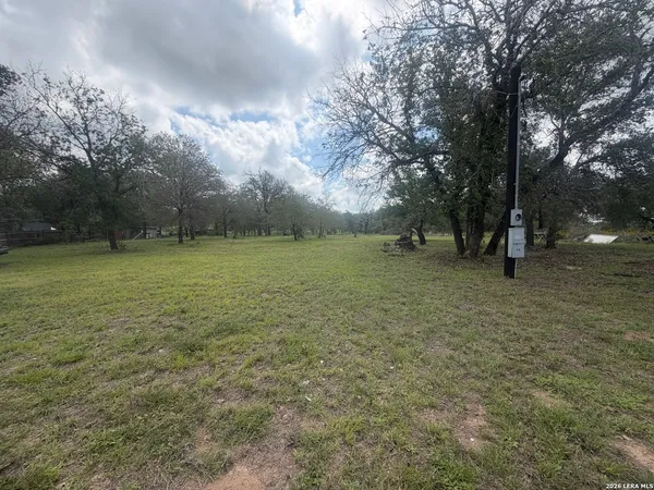 a view of outdoor space with trees all around