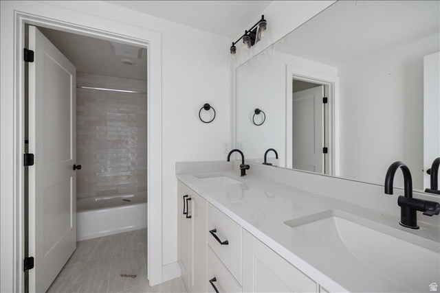 7189 South Sage Road, Unit 214 West Jordan, UT 84081 - Photo 24 of 29 Double vanity with undermount sinks and matte black fixtures