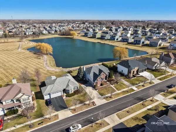 an aerial view of a house with a ocean view
