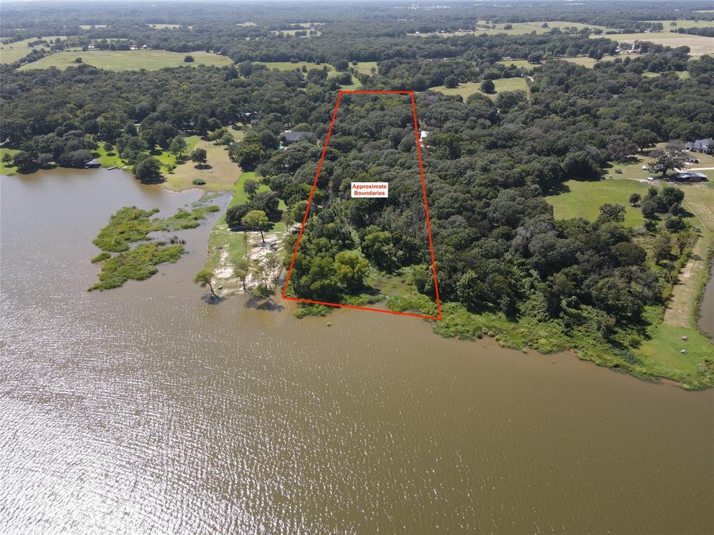 7840 Ranchette Road Eustace, TX 75124 - Photo 5 of 11 an aerial view of a houses with a yard and lake view