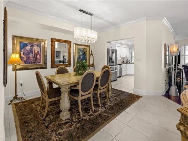 a view of a dining room with furniture wooden floor and chandelier