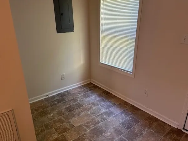 a view of a room that has a window in it