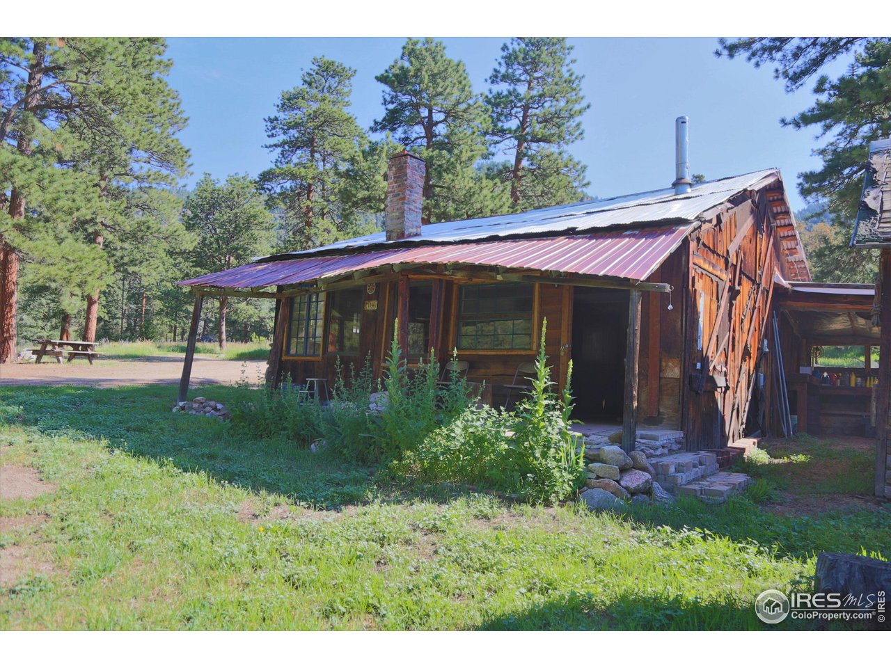 9648 Highway 36 Lyons, CO 80540 - Photo 21 of 31 a view of a house with a yard and tree s