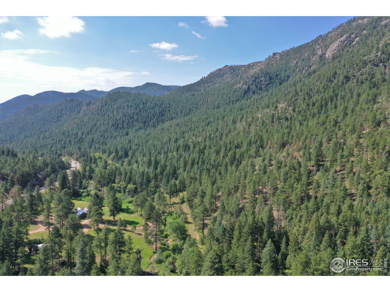 9648 Highway 36 Lyons, CO 80540 - Photo 31 of 31 a view of a lush green hillside and a mountain