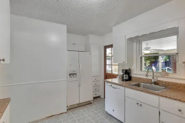 a bathroom with a double vanity sink and mirror