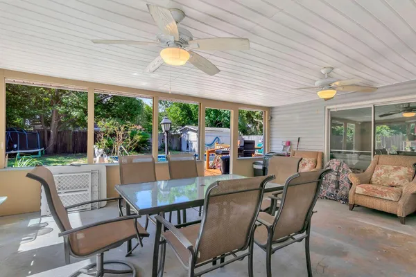 a view of a dining room with furniture window and outside view
